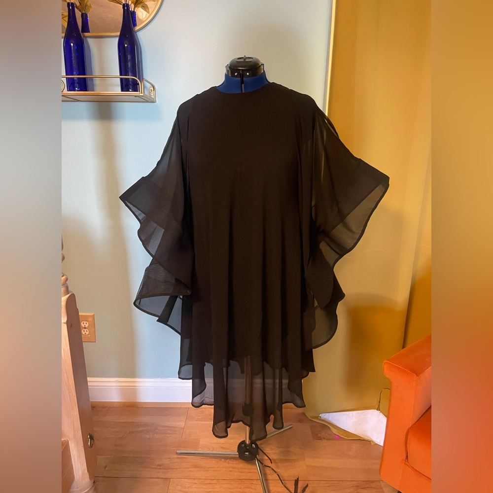 Black dramatic sleeved knee length dress